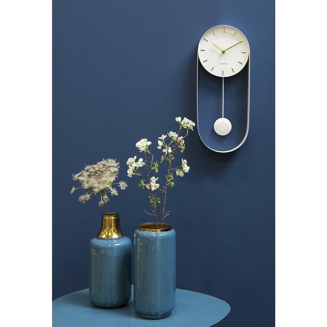 Wandklok slinger charme